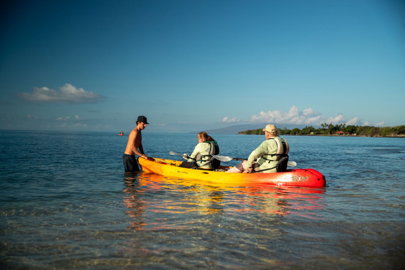 Clear water and kayaks on the Coastal Kayak tour
