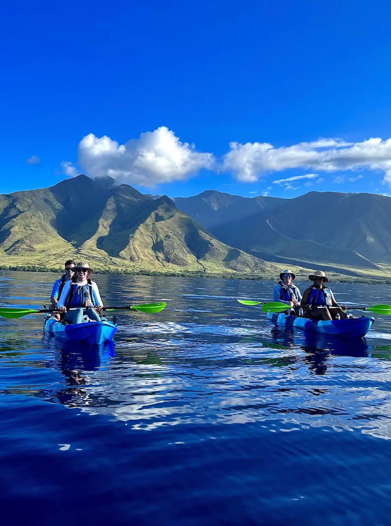 Kayaks paddling over the reef at Olowalu